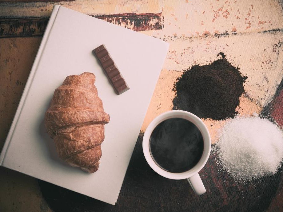 Croissant and coffee on a table